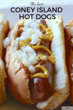 three hotdogs with condiments on them and the words coney island hot dogs