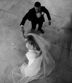 an aerial view of a bride and groom dancing