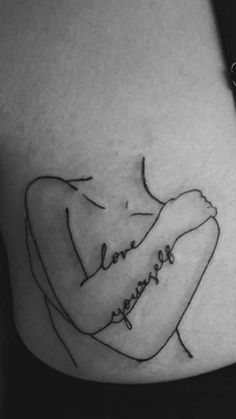 a black and white photo of a woman's stomach with the words love yourself written on it