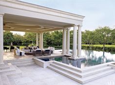 an outdoor living area with pool and patio furniture