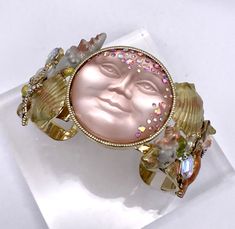 Kirks Folly Sweet Summer Shells Cuff Bracelet - Goldtone/Large New with Tags GENUINE Signed Kirks Folly Make your sweet summer so much more glam with this gorgeous open cuff bracelet, featuring a moon center and intricate shell and stone accents. Now, sink your toes into the sand, grill some fresh veggies, or head out for a dinner on the town with friends... looking fabulous for every occasion. From Kirks Folly. Design Information - Large peach moon center; shells surrounding moon; glass stones; crystalized starfish and crab - Open cuff design Product Details Color: Goldtone Size: Large Bracelet Measurements: Approx. 7-1/2"L x 1-1/2"W; 6-3/4 fit Metal Color: Yellow Finish: Polished, oxidized Additional Features: Milgrain details Packaging: Boxed with pouch and romance card Other Important Moon Glass, Bracelet Measurements, Cuff Design, Kirks Folly, Large Bracelet, Open Cuff Bracelet, Girl Closet, Sweet Summer, Fresh Veggies