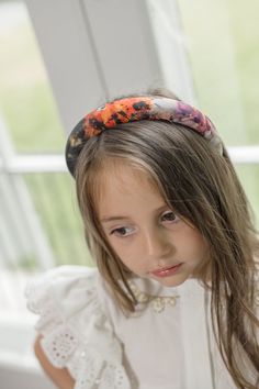 The Alexis Foliage Print Headband is a padded headband for girls that features beautiful foliage print fabric. The headband is designed to be comfortable and lightweight, perfect for everyday wear. The vibrant foliage print adds a touch of fun to any outfit. Made to match our Alexis Collection 100% Polyester Lined for comfort Suitable for 2 Years and older Made in Turkey Care Instructions: Spot clean only. Foliage Print, Padded Headband, Girls Headbands, Signature Design, Print Fabric, For Girls, Care Instructions, Printing On Fabric, Everyday Wear