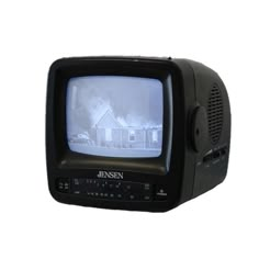 an old fashioned television with the image of a house on it's display screen