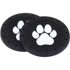 two black and white coasters with paw prints