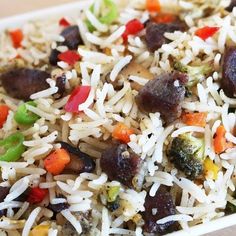 rice and vegetables are mixed together in a dish