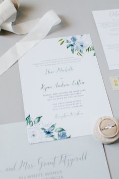 the wedding stationery is laid out on the table