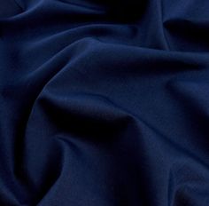 a close up view of a dark blue fabric