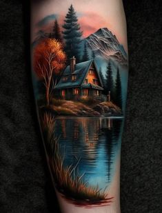 a painting on the leg of a person with a house and trees in the background