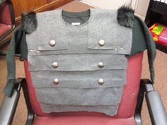 a chair that has some kind of armor on it