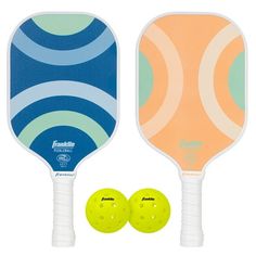 two paddles and two balls on a white background