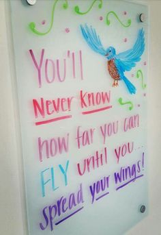 a sign that says you'll never know how far you can fly until you spread your wings