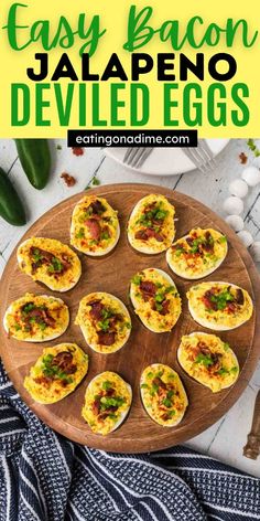 deviled eggs with bacon and jalapeno on a wooden platter