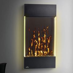 a wall mounted fire place with glowing flames