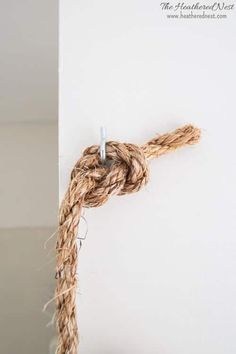 there is a rope that has been tied to the wall