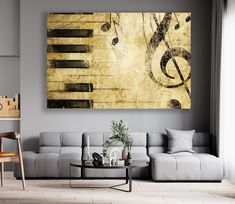 a living room with a couch, coffee table and piano keys on the wall above it