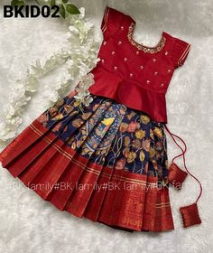 your Beautiful baby girl looks like BABY-DOLL when she wearing the *BK KIDS*collection Exclusive Banarasi Big Border with Kalamkari lehenga paired with pretty *maggam work on silk blouse* Can can skirts' with 2 layers crepe lining and 4 inches canvas belt *Code-BKID02* For *mother-daughter* combo avl with code-*BK384N* Please kindly purchase below item rm https://www.etsy.com/uk/listing/1314839937/a-super-charming-black-handloom-silk Pattu Lehenga For Kids, Lehenga Pattu, Kalamkari Lehenga, Girl Silk Dress