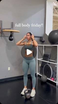 a woman standing in front of a gym ball talking on a cell phone with the caption full body friday