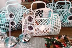 several baskets with decorative items in them on a table