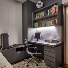 a room with a desk, chair and bookshelf in it's corner