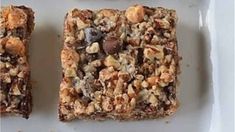 two pieces of granola bars on a white plate