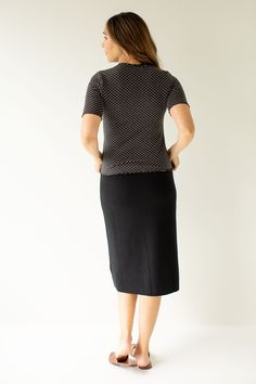 Meet the 'Elaine' sweater skirt – the perfect addition to your closet for the colder weather! Cozy up by the fire in this comfortable knit sweater skirt. Pair with a sweater and low ankle boots for a classic and cozy fall look! Exclusively designed by us with you in mind. 100% Cotton Hand Wash Cold Lay Flat to Dry Unlined Model Height 5'9" | Wearing Size Small Model Height 5'8" | Wearing Size 1X Please carefully measure a similar item before placing your order to allow for the best fit and also Fitted Knit Skirt For Work, Casual Knit Skirt For Work, Casual Fitted Skirt For Layering, Black Knit Skirt For Fall, Low Ankle Boots, Dot Texture, Layered Tops, Mock Neck Top, Low Iron