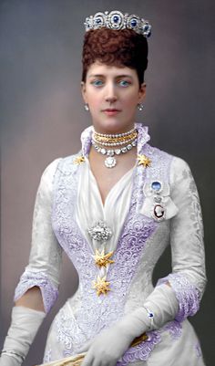 a woman in a pink dress and tiara