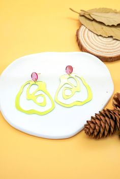 Brighten up your accessory game with these eye-catching Neon Yellow Mirror Acrylic Earrings. Featuring a bold, reflective neon yellow finish, these earrings are designed in a striking abstract shape, perfect for adding a pop of modern flair to your outfits. Complemented by a soft pink stud accent, this unique design exudes contemporary charm and artistic elegance. Ideal for casual wear, parties, or as a thoughtful handmade gift, these lightweight earrings are comfortable enough to wear all day while making a bold fashion statement. Key Features: 💛 Material: Premium mirror acrylic in vibrant neon yellow with a pink stud accent. 💛 Design: Abstract, modern, and playful for a standout style. 💛 Lightweight: Easy and comfortable to wear for extended periods. 💛 Handcrafted: Made with care for Yellow Mirror, Yellow Mirrors, Abstract Jewelry, Pink Studs, Thoughtful Gifts For Her, Roses Design, Abstract Shape, Mirror Acrylic, Jewelry By Material