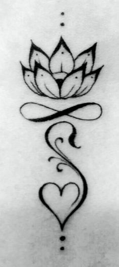 a lotus tattoo on the back of a woman's stomach, with hearts and leaves