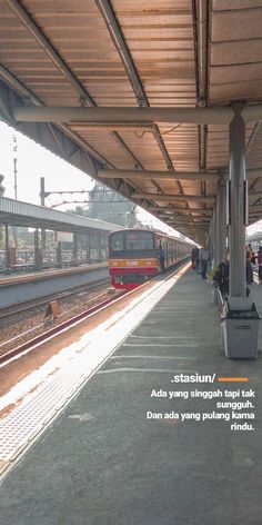 people are waiting at the train station to get on or off their trains for boarding