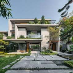 an exterior view of a modern house in the middle of a garden area with grass and trees