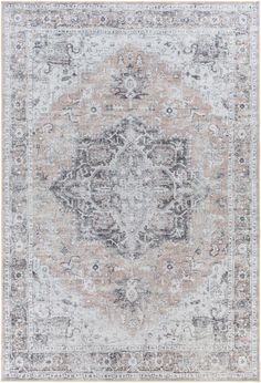 an antique style rug in grey and beige tones