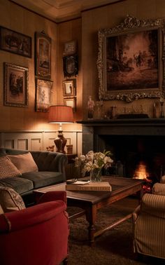 a living room with two couches and a table in front of a fire place