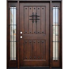 a wooden door with glass panels and wrought iron bars on the top half of it