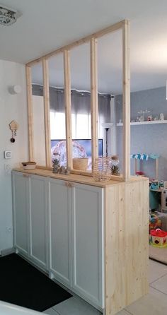 a kitchen with cabinets and shelves in it