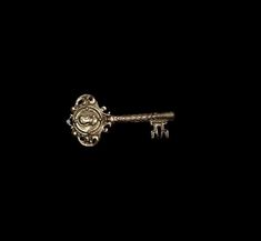 an old key is shown in the dark