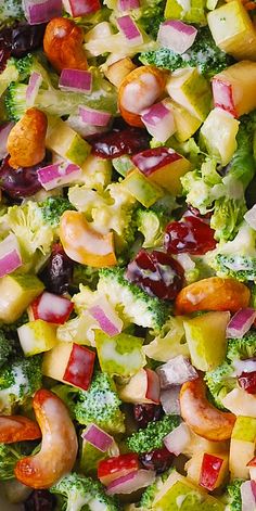 a salad with broccoli, cranberries and other vegetables