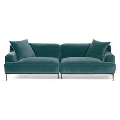 a blue couch with two pillows on it and one arm folded back to the side