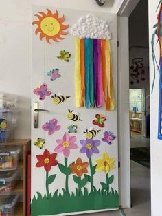 a door decorated with paper flowers and bees