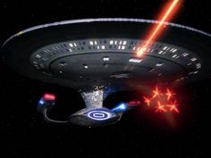 a star trek ship flying through space with red lasers coming out of it's center