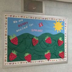 a bulletin board with strawberries on it and the words we are berry excited for spring