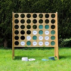 a giant board game sitting in the grass