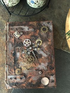 an old metal box with gears on it