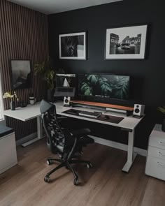 a home office with black walls and white desks