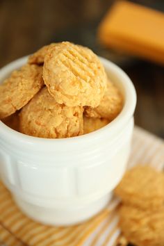 a white bowl filled with cookies on top of a table