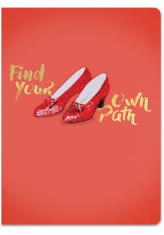 a pair of red shoes with the words find your own path