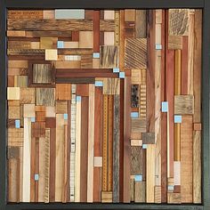 an art piece made out of wooden planks with blue and brown squares on it