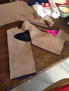 several pieces of paper sitting on top of a wooden table