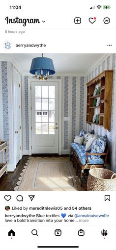 an image of a living room with blue and white wallpaper