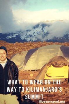 a man standing in front of tents with the words what to wear on the way to kilimaro's summit