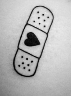 a black and white photo of a tattoo with a heart on it